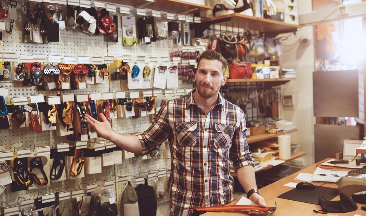 Man in plaid shirt at retail store